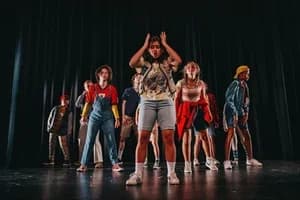 Everyday Charlie cast mid-number on stage