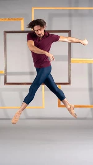 A Ballet Counterpointe dancer mid-leap in Whiplash